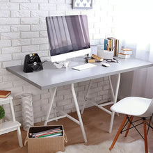 Black personal heater on desk with fan grille and indicator light