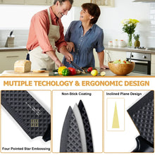 Kitchen knife set closeup with three knives and textured black blades