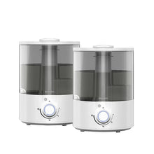 Ultrasonic humidifier base with white body, clear tank panels, and blue-lit control dial