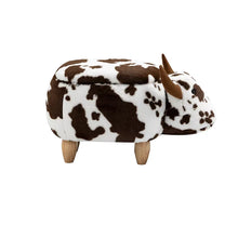 Cow-shaped ottoman with brown-and-white spots, horned ears, and wooden legs