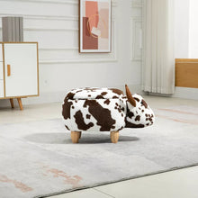 Cow print ottoman with small horns, rounded seat, and wooden legs