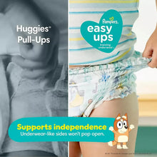 Training underwear with side openings, worn on child, blue-and-white character print
