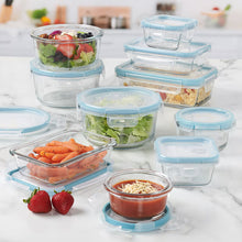 Clear round and rectangular food storage containers with blue snap lids holding ingredients