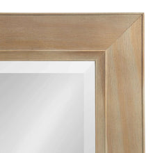 Rustic wood frame corner of a rectangular wall mirror with recessed inner panel