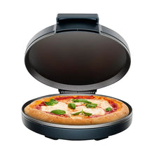 Pizza oven with lid open, holding a round pizza on the cooking plate