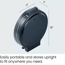 Portable pizza oven shown from the side with lid closed and compact upright shape
