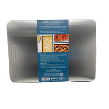 Oven crisping set metal tray and perforated racks, back of retail package visible.