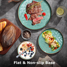 Green stoneware plates and bowls arranged with cooked meat and salad.