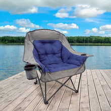 Gray folding camping chair with blue cushion and attached side cup holder