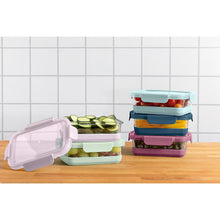 Glass food storage containers with pastel lids, one container lid open