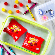 Fruit Smiles snack pouches in a green tray with fruit-flavored candy pieces