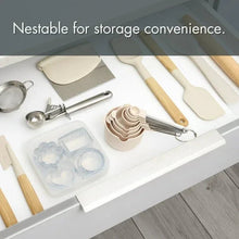 Light gray nesting measuring cups and spoons set with stainless steel tools
