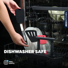 Black silicone spatulas placed in a dishwasher rack