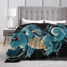Flannel throw blanket with teal turtle character graphic on black background