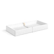 White contoured changing pad with raised edges and center divider panel