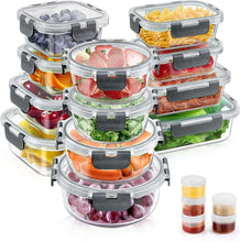 Clear glass food storage containers with black airtight lids, stacked set with mini jars.