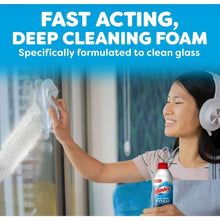 Windex Fast Shine Foam glass cleaner aerosol bottle with red cap being applied to glass.