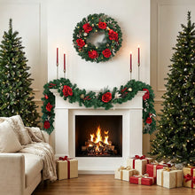 Evergreen garland with red rose ornaments and pinecones across a mantel