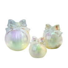 Set of three iridescent glass bow ornaments in graduated sizes