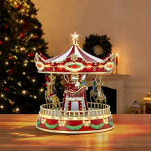 Animated carousel toy with red canopy, rotating horse figures and golden base