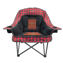 Heated lounge chair with glowing orange heat panel on black fleece seat