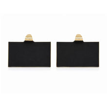 Pair of stocking holders shown from behind, with black rectangular bases
