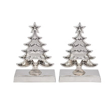 Pair of polished silver Christmas tree stocking holders on flat bases