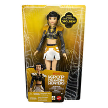 Singing doll in box wearing black-and-gold crop jacket and white skirt