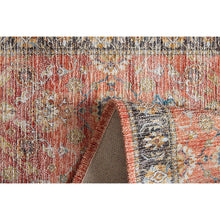 Red accent mat close-up with dark border, dense pattern, and layered edges
