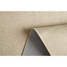 Woven accent mat edge detail with folded hem and dark underside