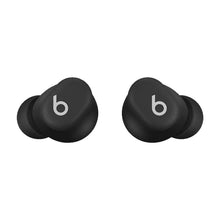Two dark wireless earbuds with silicone tips, angled view, b logos on outer faces