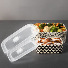 Two-piece ceramic baking dish set with dot and triangle patterns, lids open