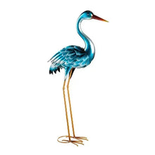 Heron metal statue with teal body, orange beak, gold wire legs, and round feet.
