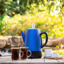 Blue electric coffee percolator with black base, side handle, and clear glass lid