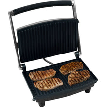 Indoor grill with open black ridged plates, showing four toasted sandwich halves