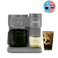 Moonlight grey Keurig coffee maker with carafe, single-serve cup, and buttons