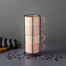 Four stacking mugs in a metal rack, pink stoneware with white chevron lines