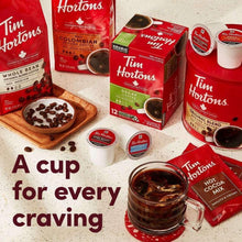 K-Cup coffee pod variety with boxes and cup of dark coffee on countertop