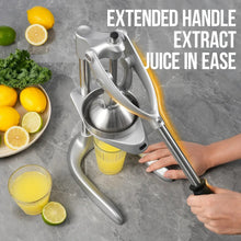 Manual citrus juicer press with extended handle and cup collecting fresh juice