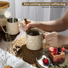 Ceramic coffee mug with curved handle, filled with coffee, light beige textured finish