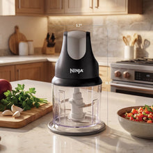Ninja Express 2-cup food processor with clear bowl and blade, on kitchen counter