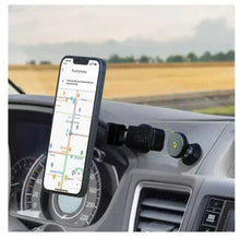 Magnetic dash phone mount holding a smartphone in car
