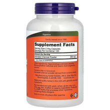 Activated charcoal supplement bottle back label on white container with purple cap