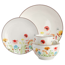 White stoneware dinnerware set with two plates and stacked bowl and mug