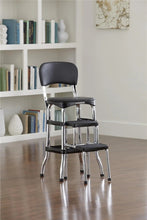 Black retro step stool with cushioned backrest, padded seat, and three steps