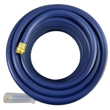 Coiled medium-duty garden hose in dark blue with brass fitting and gray end.