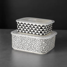 Stacked rectangle ceramic baking dishes with black-and-white dot and triangle patterns