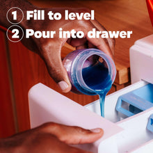 Detergent poured from bottle into washer drawer