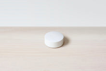 White smart temperature sensor puck
