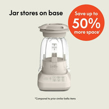 Countertop blender with clear jar stored on base to save space, featuring beige housing